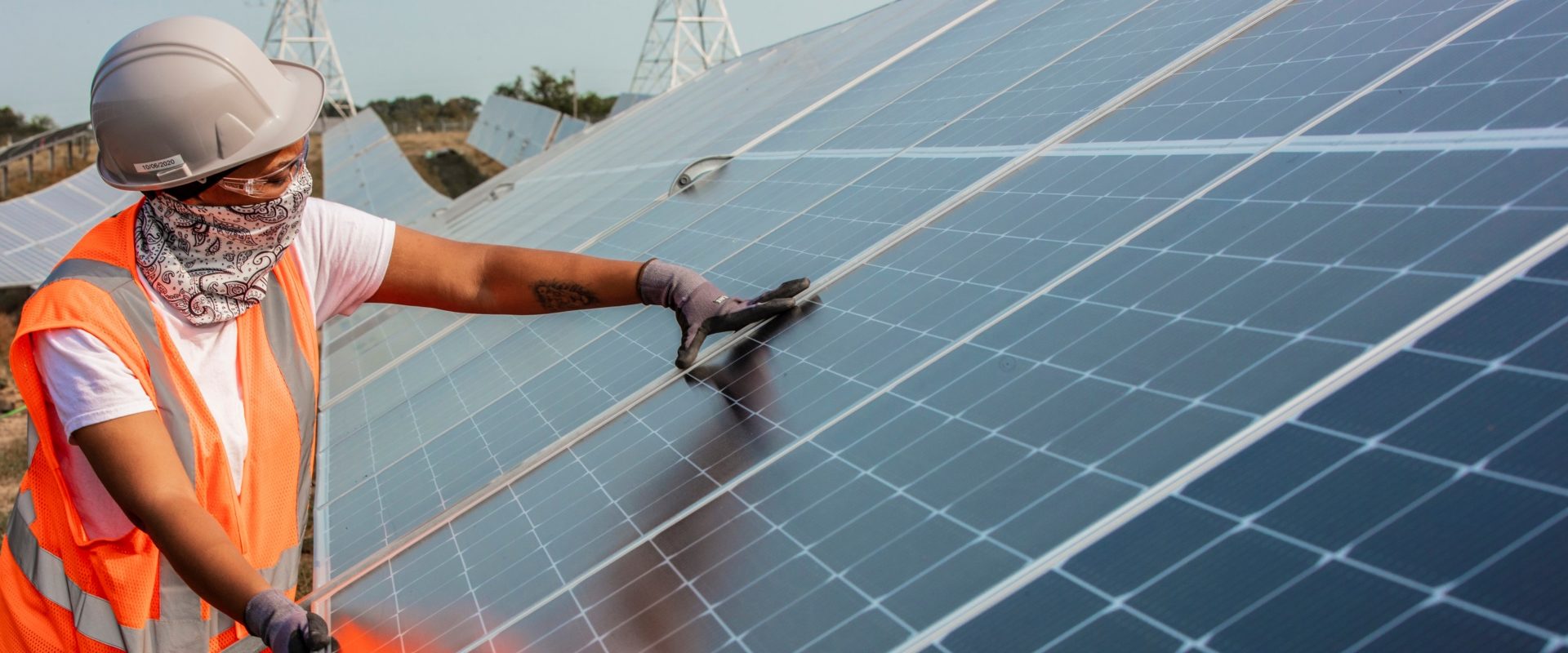 Worker holding solar panel