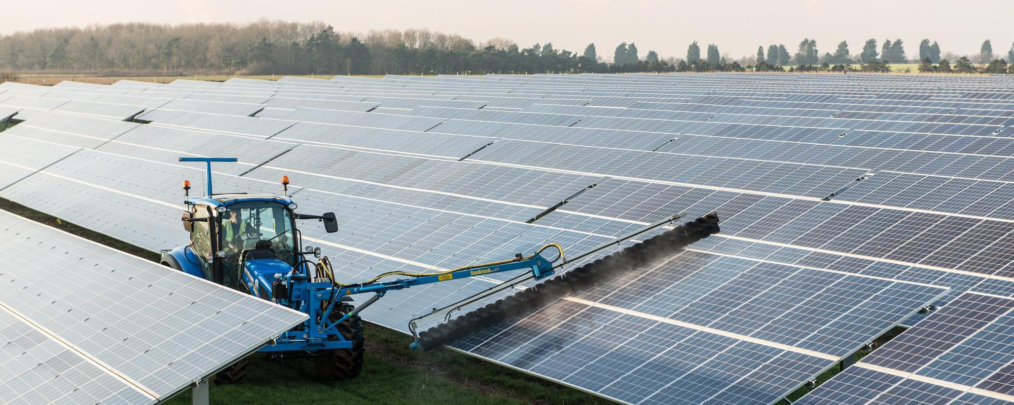 tractor cleaning solar panels