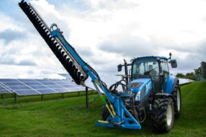 Tractor cleaning solar panels