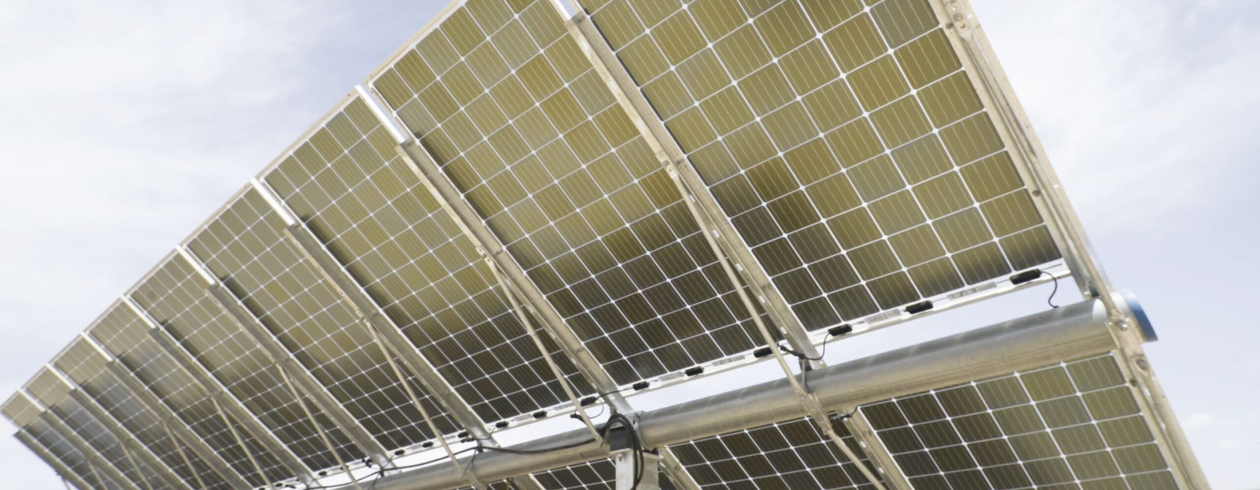 Close-up of solar panels tilted towards the sky