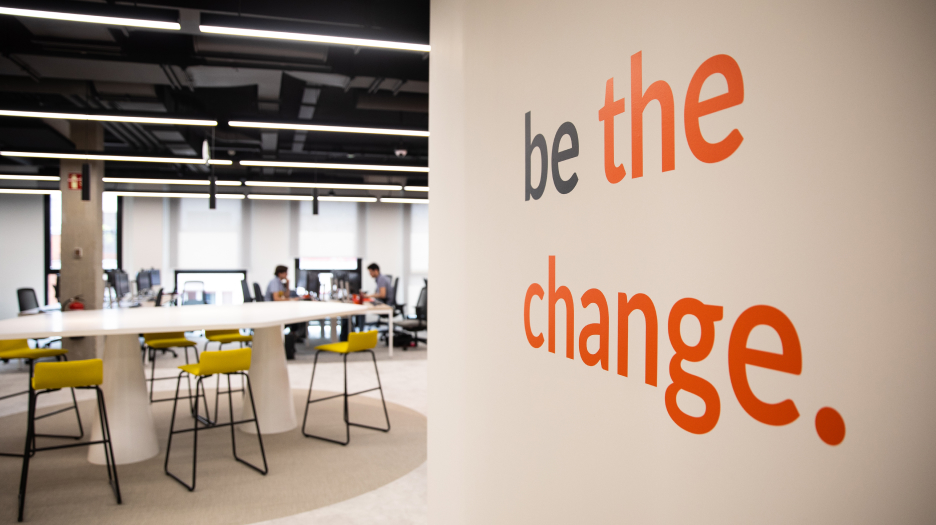 A modern office space with a wall sign that reads 