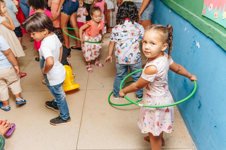 children playing with hula hoops